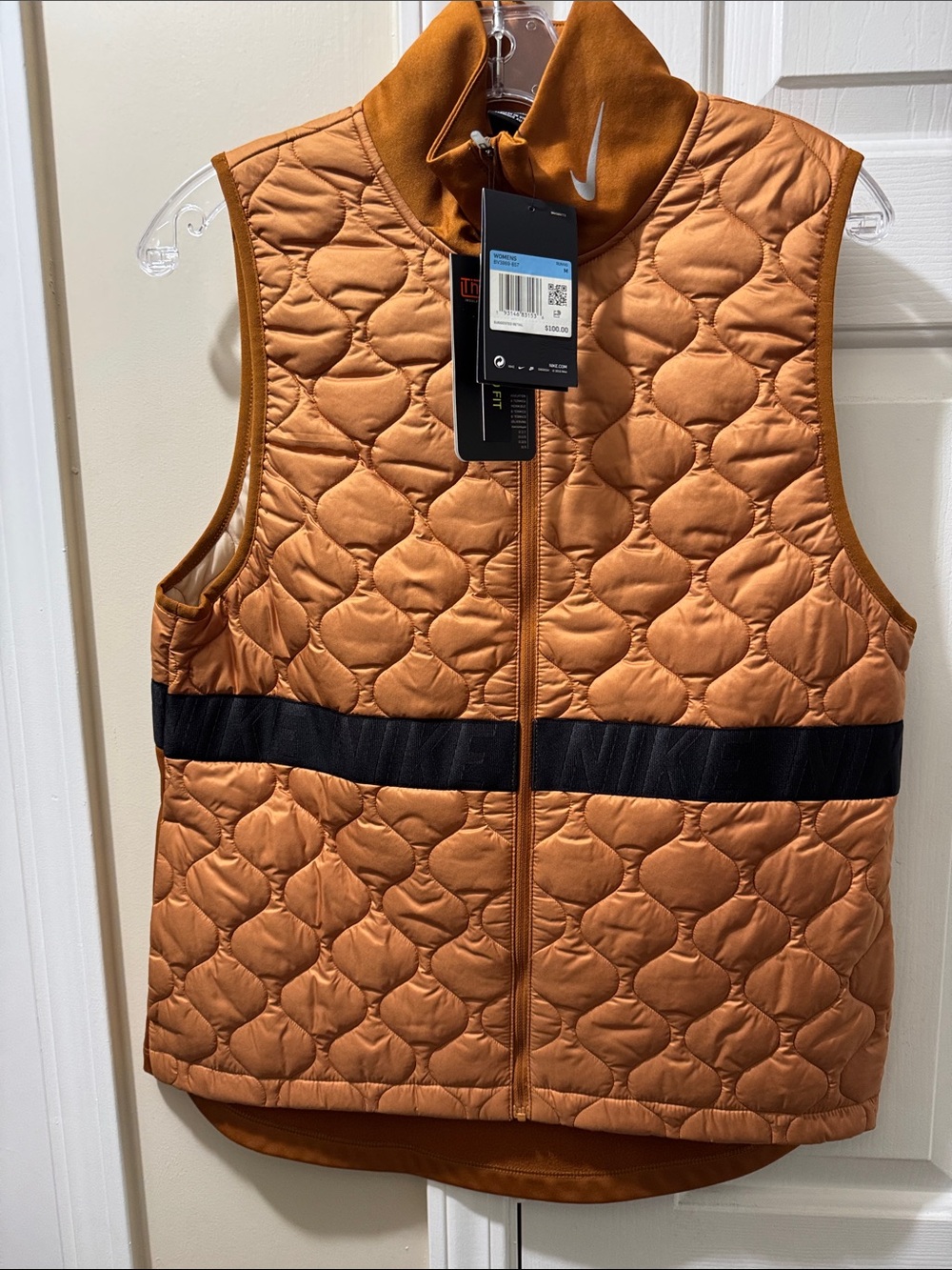 Women’s medium lNike Quilted Orange Sleeveless Vest with Black Waist Strip